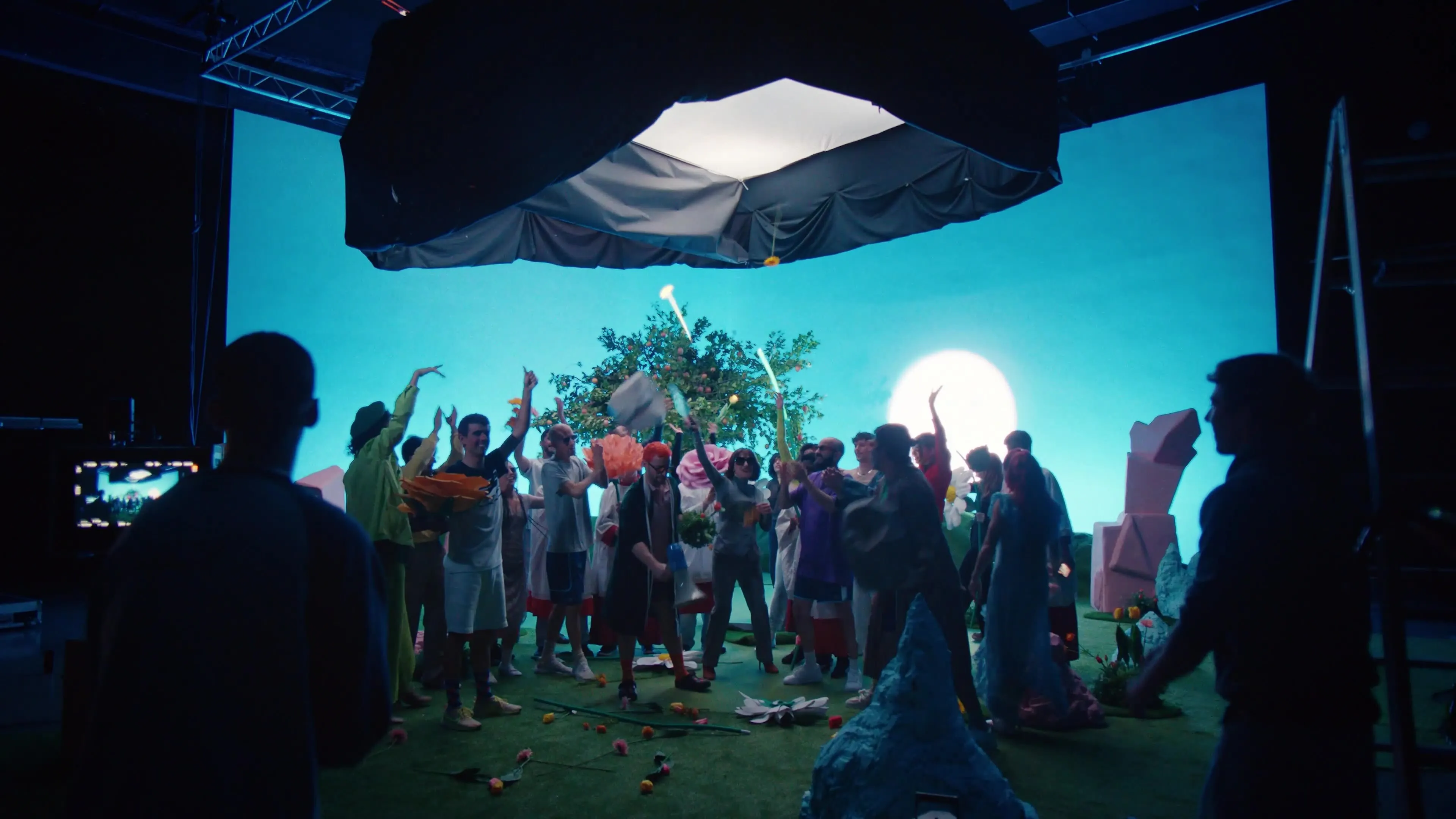 Nighttime shoot with a large production crew under a full moon.
